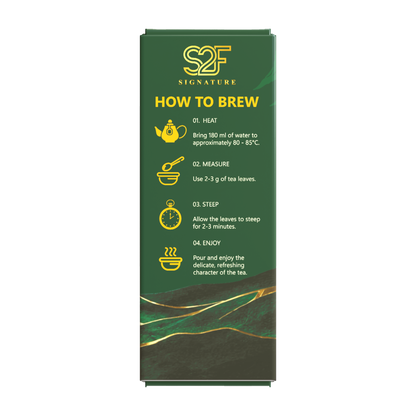 S2F Signature Emerald Reserve Pure Green Tea 100g box packaging left side view showing How to Brew step by step instructions on transparent background